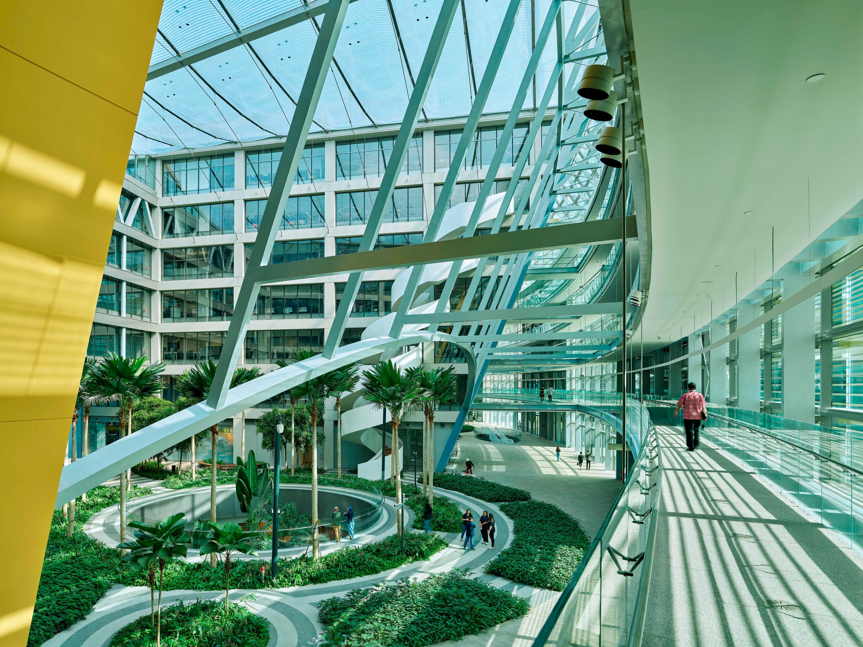 SJ Campus by Safdie Architects features elevated walkways and generous courtyards that integrate indoor gardens with office spaces
